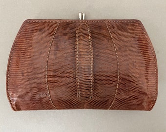 A vintage lizard skin clutch bag from John Pound & Co. London in tan brown.