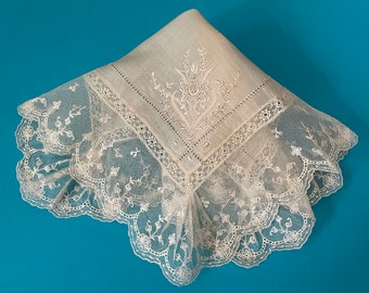 A small pretty silk and lace handkerchief in pale cream.
