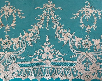 An antique Brussels lace panel in ivory.