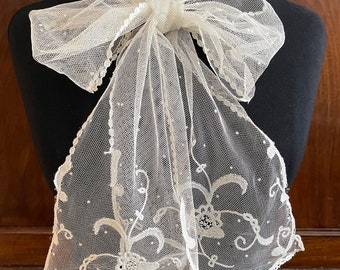 A pretty antique scarf, spotted net and Brussels applique lace ends. Ivory.