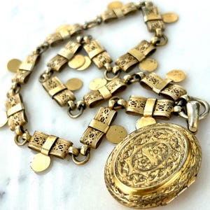 Antique Victorian Chased Locket with Bow Style Chain ((1875-1885), Gold Vermeil, Bronze, 17” Chain, 2” Locket