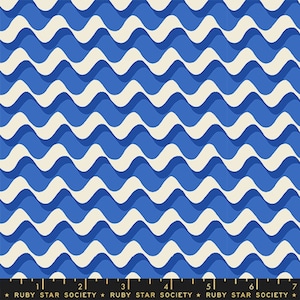 May include: A fabric pattern featuring a repeating wave design in shades of blue and cream. The waves create a rhythmic, flowing pattern across the surface. The text "RUBY STAR SOCIETY" is printed at the bottom.