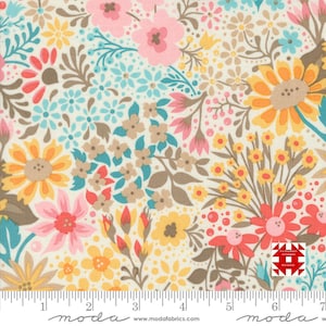 May include: Floral fabric with a cream background, featuring a variety of colorful flowers. The design includes pink, yellow, orange, and blue blossoms, along with brown and teal accents. A ruler is visible along the bottom edge.