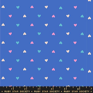 May include: A vibrant blue fabric featuring a repeating pattern of small, colorful hearts. The hearts are in shades of pink, teal, and cream, creating a cheerful and playful design. The fabric is suitable for various crafting projects.