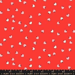 May include: Red fabric with a scattered pattern of small strawberries. Each strawberry is white with a pink center and a small green stem. The fabric has a black border with the text "RUBY STAR SOCIETY".