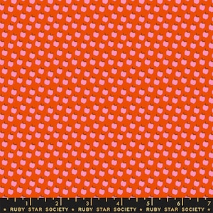May include: Orange fabric with a repeating pattern of pink apples. The apples have brown stems and are evenly spaced across the fabric. The text "RUBY STAR SOCIETY" is printed at the bottom.
