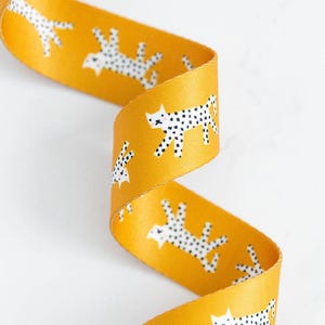 1.5&quot; Snow Leopard Webbing by Rashida Coleman-Hale with Ruby Star Society -Snow Leopard on Golden/Yellow (Item #SSCWEB 22) - sold by the yard
