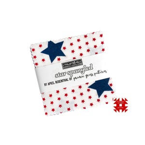 May include: A stack of fabric squares with a white background and a pattern of red stars. The fabric squares are wrapped with a white band that reads "star spangled" and "BY APRIL ROSENTHAL of prairie grass patterns". A blue star is visible on the fabric.
