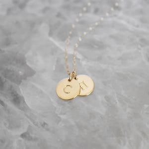 Tiny personalized initial multiple gold charm necklace // personalized hand stamped necklace // monogram necklace // tiny disc necklace