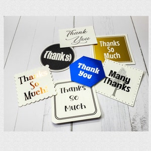May include: Assortment of thank you cards with different designs and colors. The cards feature various phrases like "Thank You", "Thanks So Much", and "Many Thanks".