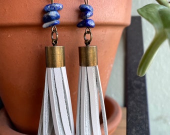 White leather tassel earrings made with brass and Lapis Lazuli.