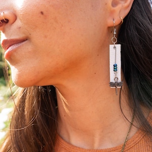 Silver dragonfly leather drop earrings
