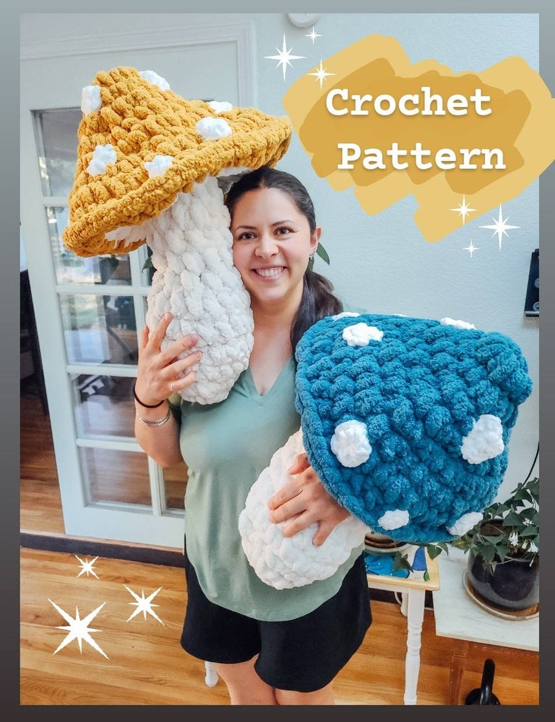 May include: A woman holds two large crocheted mushroom pillows. One mushroom is yellow with white dots and the other is blue with white dots. The text "Crochet Pattern" is written in white on a yellow background.