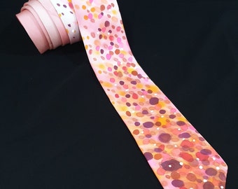 Salmon pink silk tie with spotted highlights