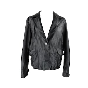 May include: A black leather blazer with a single button closure and two flap pockets. The blazer has a classic, tailored fit.
