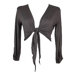 May include: A dark gray, long-sleeved, tie-front top with a deep V-neckline. The top is made of a soft, stretchy fabric and has a relaxed fit.