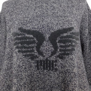 May include: Gray sweater with a black embroidered design of wings and the word "FORCE" in the center.