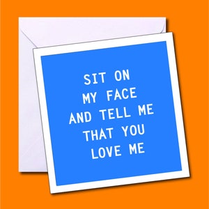 May include: A white ceramic mug with a black handle and the text "But First, Coffee" in a black, handwritten-style font. The mug is on a white surface.