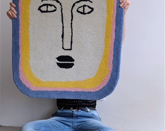 Hand-tufted rectangular face rug in 100% wool