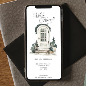 May include: A smartphone screen shows a digital moving announcement. The design features a watercolour illustration of a white door with greenery and potted trees. The text reads "We've Moved!" and includes the new address: 23 Kings Terrace, Primrose Hill, London, NW1 8TD.