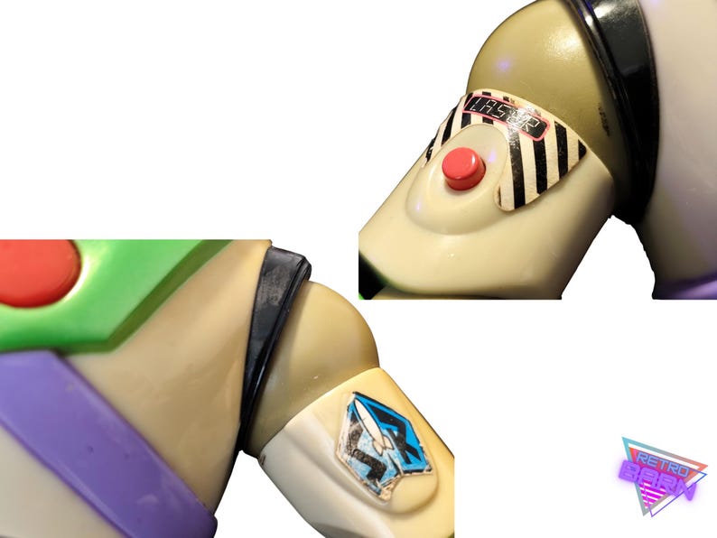 May include: Close-up of a Buzz Lightyear action figure. The figure features a cream-colored body with green, purple, and black accents. A red button and a sticker with the word "LASER" are visible. A blue and white emblem is on the arm.