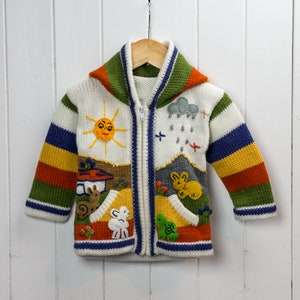White Rainbow Hand Knitted, Fair Trade Children's Cardigan with Pixie Hood, by INKITA. image 3