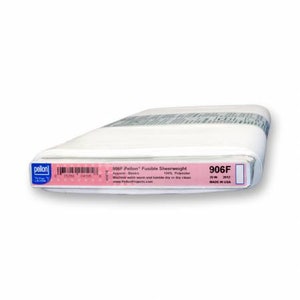 May include: A white roll of 906F Pellon® Fusible Sheerweight interfacing for apparel. The label reads "906F Pellon® Fusible Sheerweight Apparel Backing 100% Polyester Machine wash warm and tumble dry on low heat www.PellonProjects.com 20 in x 12 yd MADE IN USA".