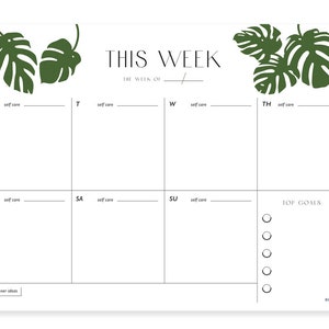 May include: A printable weekly planner with a tropical leaf design. The planner includes sections for each day of the week, with space for self-care activities, top goals, and dinner ideas. The text "THIS WEEK" and "THE WEEK OF" is included.