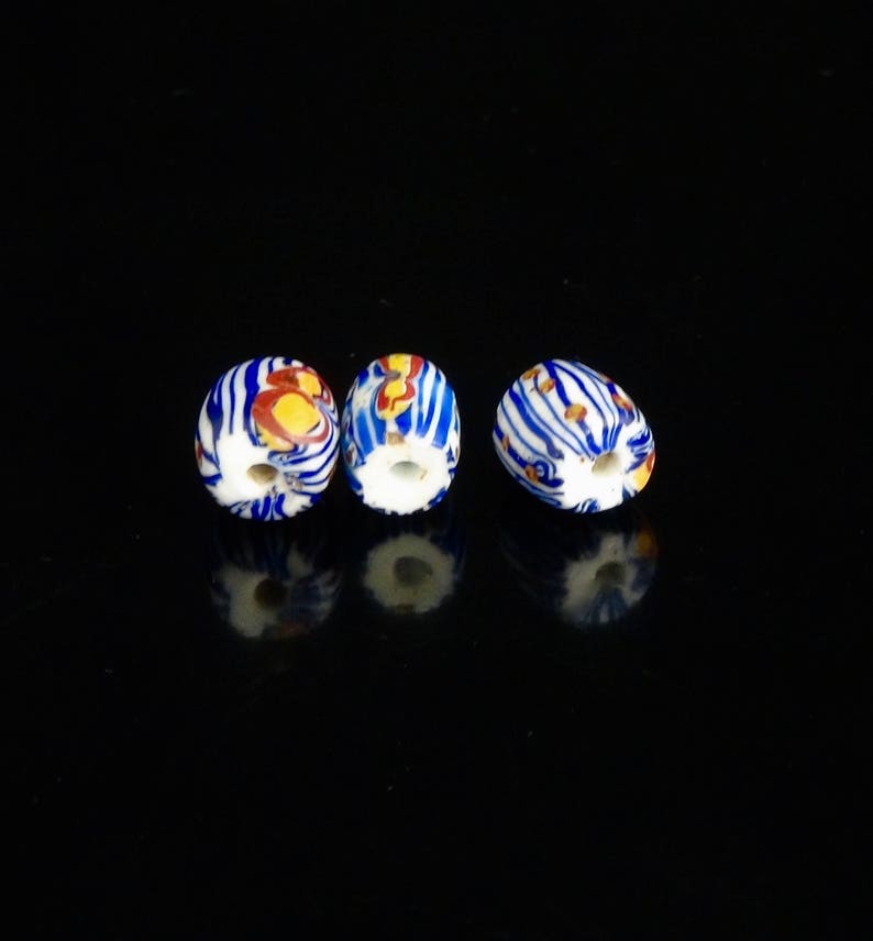 V 055 Three very pretty antique Venetian fancy beads