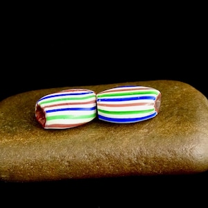 A set of two old tabular 3 layer chevron beads with stripes added: V 155