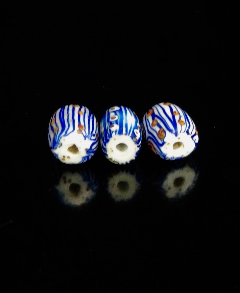 V 055 Three very pretty antique Venetian fancy beads