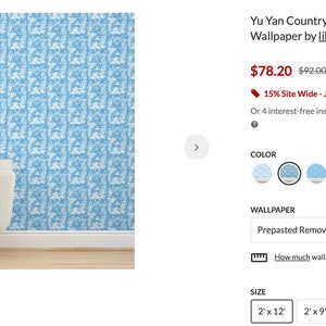 May include: Blue and white patterned wallpaper with a prepasted removable smooth finish. The wallpaper is shown in a room with a white sofa. The wallpaper is available in a variety of sizes, including 2' x 12', 2' x 9', 2' x 6', and 2' x 3'.