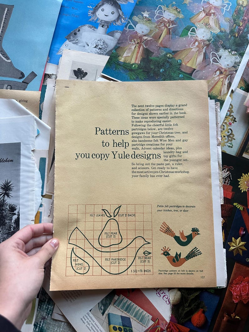 May include: A page from a vintage craft book with instructions and patterns for making felt Christmas decorations. The patterns include a pear, a bird, and a wing. The text reads "Patterns to help you copy Yule designs".