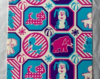 May include: A white background with a repeating pattern of blue, pink, and purple octagons. Each octagon features a different animal, including a duck, elephant, dog, and cat. The animals are all cartoon-like and have a playful design.