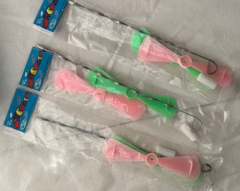 ONE (1) Vintage Plastic Wheeler Spinning Toy - HONG KONG