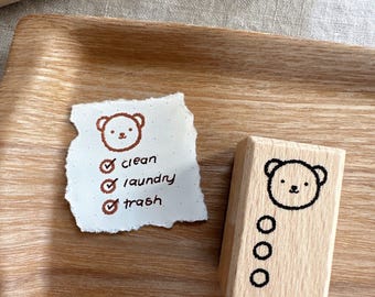 Tampon en bois pour la liste de contrôle des ours