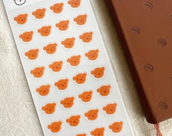 L'ours est heureux en feuille d'autocollants