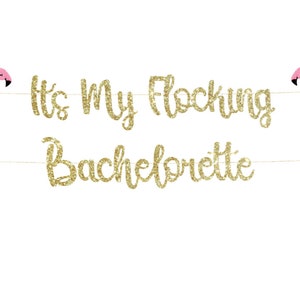 May include: Gold glitter banner with the text "It's My Flocking Bachelorette" and two pink flamingo cutouts.