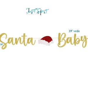 May include: A gold glitter banner spelling Santa Baby with a red and white Santa hat in the center. The text JustTopit appears at the top. The banner is 39 inches wide and the tallest letter measures 7 inches. The letters are strung on a thin line.