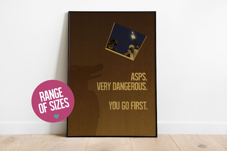 May include: A brown poster with a wolf silhouette and the text "ASPS. VERY DANGEROUS. YOU GO FIRST." in gold lettering. A small photo of a person holding a torch is in the upper left corner.