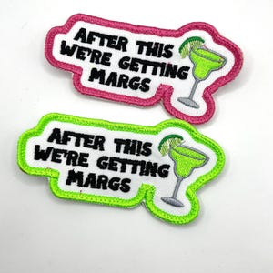 May include: Two embroidered patches with the phrase "AFTER THIS WE'RE GETTING MARGS." One patch has a pink border, the other a neon green border. Both feature a margarita glass with a lime wedge.