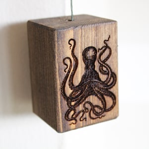 Octopus Clock handmade by my dad with woodburning tools (i wasn't