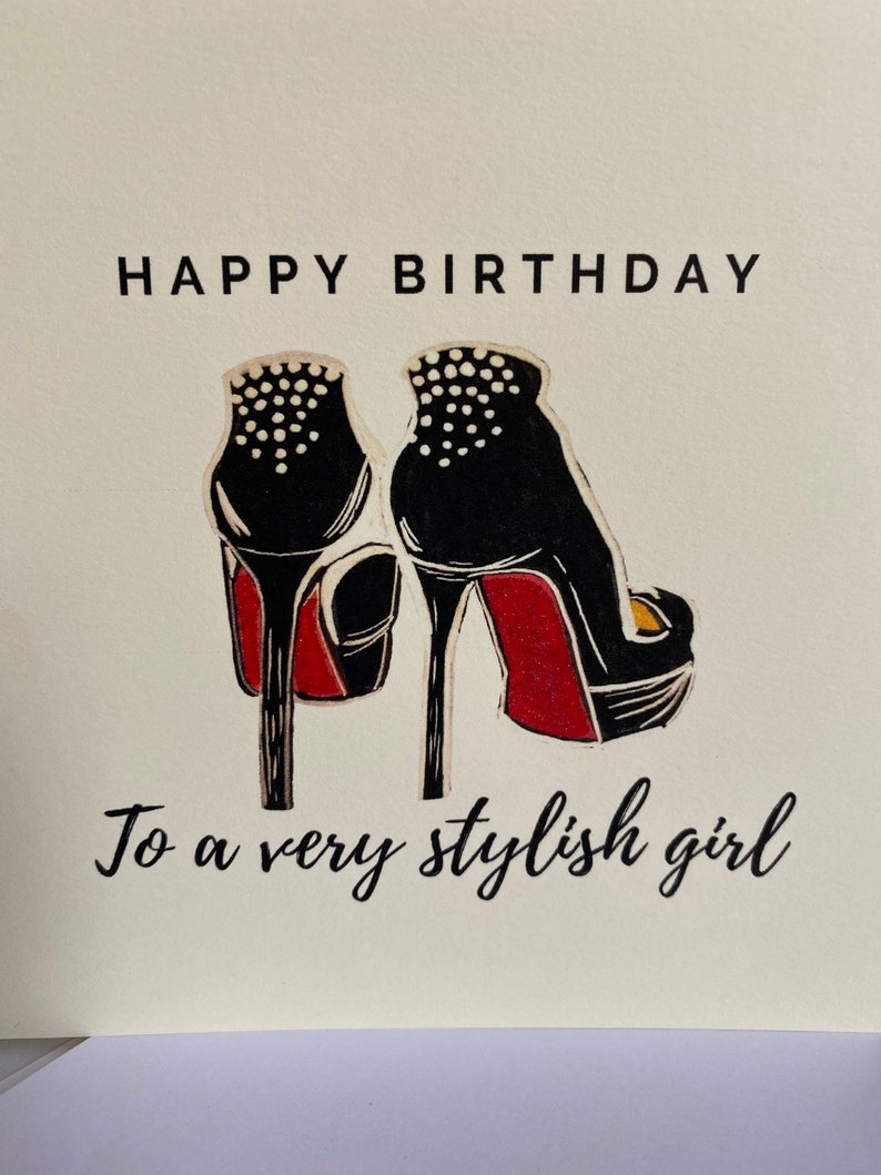 May include: Happy Birthday to a very stylish girl card with a black and red high heel shoe illustration.