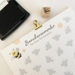 Könnte beinhalten: Ein druckbarer Bienenthemen-Chart mit dem Text "Bienchensammler Mein kleiner Motivationsshelfer" und einem Raster mit Bienensilhouetten. Der Chart ist als Motivationshilfe für Kinder gedacht.