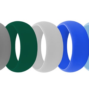 May include: Ten silicone rings in a variety of colours, including black, grey, green, blue, and silver. The rings are all the same size and shape, and they are arranged in a row.