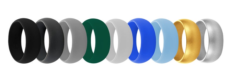 May include: Ten silicone rings in a variety of colours, including black, grey, green, blue, and silver. The rings are all the same size and shape, and they are arranged in a row.