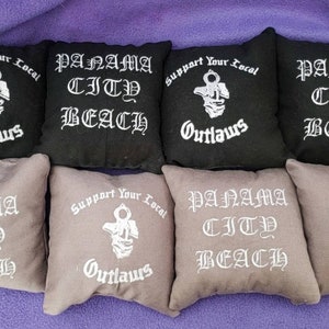 SYLO Bean Bag Cornhole Bags Regulation Size & Weight Support Your Local Outlaws embroidered on 2 sides  8 bags..  4 of each color