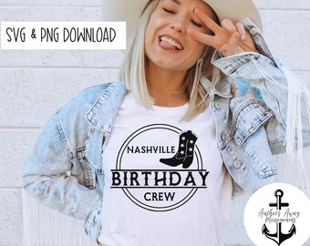 May include: A white t-shirt with a black circle design that says "Nashville Birthday Crew" with a pair of black cowboy boots with white stars on them. The design is on a white t-shirt being worn by a person.