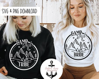 May include: Two white sweatshirts with black graphic designs. The design features a circle with mountains, a campfire, a moon, and stars. The text reads "Camp Back Tribe" and "Camp Back Bride".