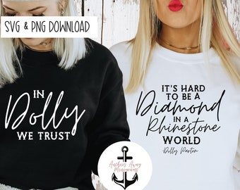 May include: Two women wearing black and white sweatshirts with a quote from Dolly Parton. The black sweatshirt says "In Dolly We Trust" and the white sweatshirt says "It's hard to be a Diamond in a Rhinestone World - Dolly Parton".
